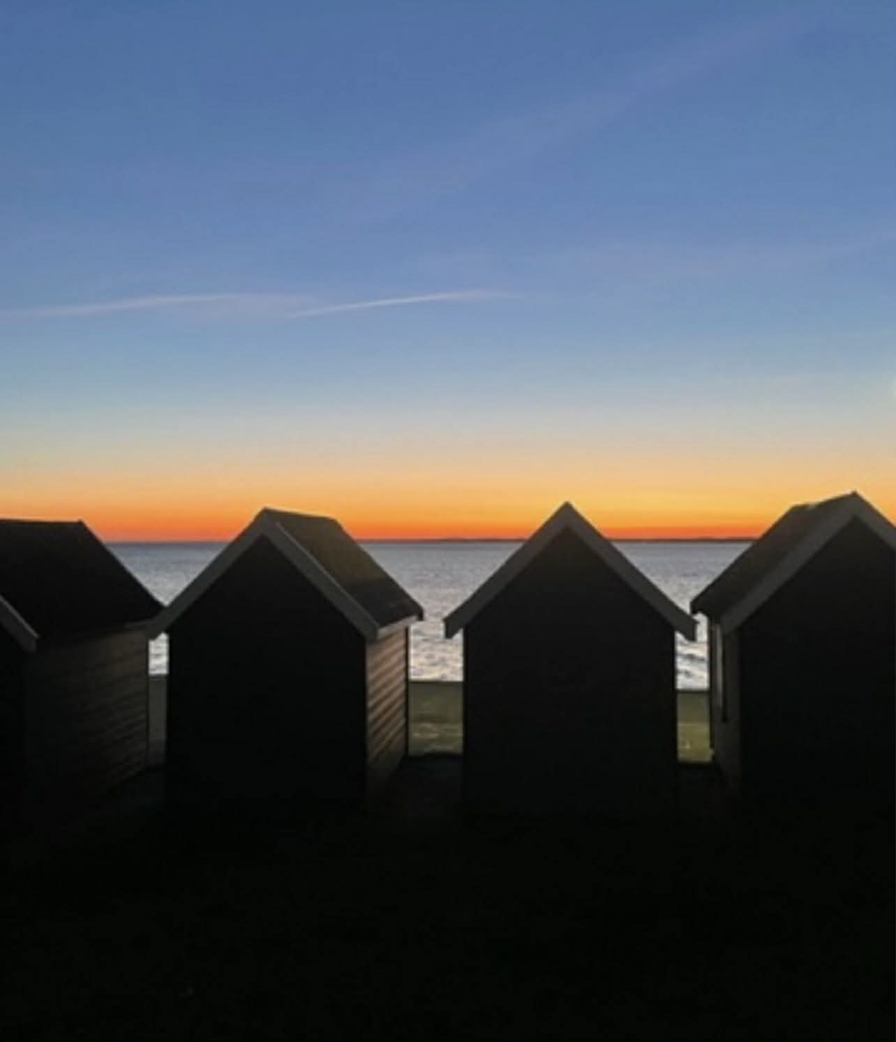 Dusk shot of huts by the beach